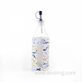 Glass oil bottle with plastic casing